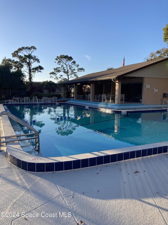 view of swimming pool featuring a patio area