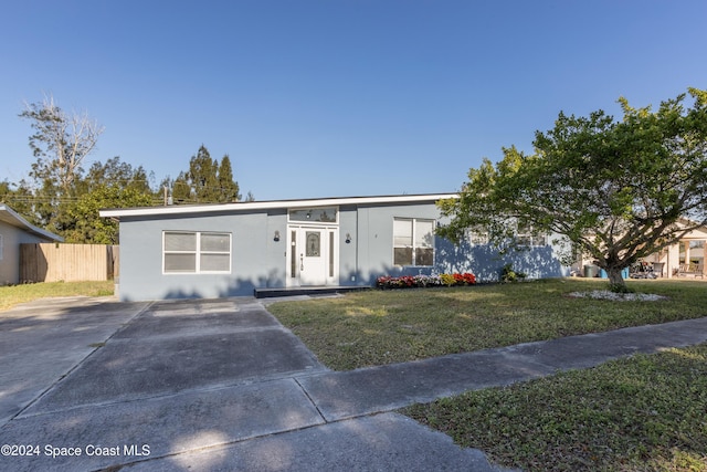 ranch-style house with a front yard