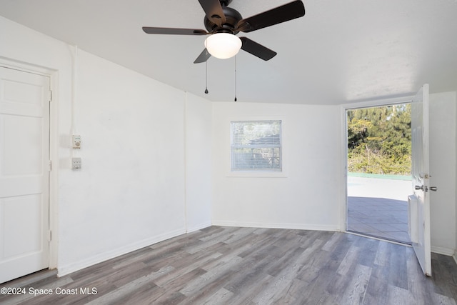 empty room featuring ceiling fan and light hardwood / wood-style flooring