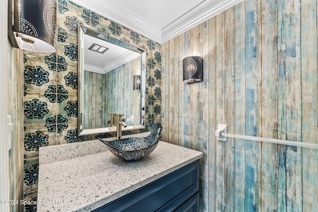 bathroom with vanity and ornamental molding