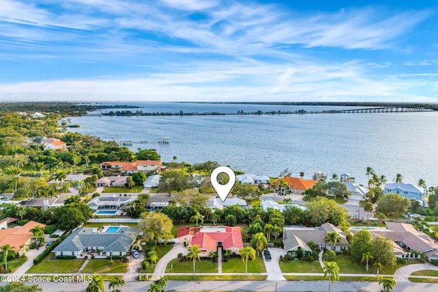 birds eye view of property featuring a water view