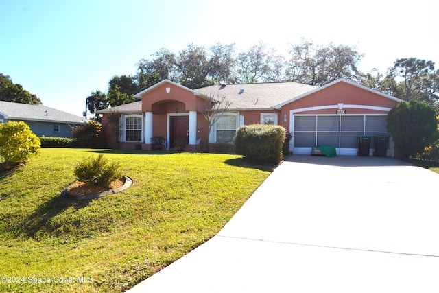 ranch-style house with a front lawn and a garage