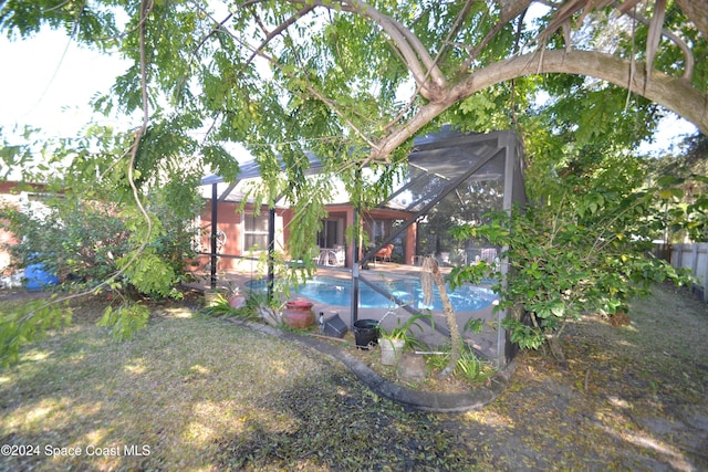 view of pool with a lanai