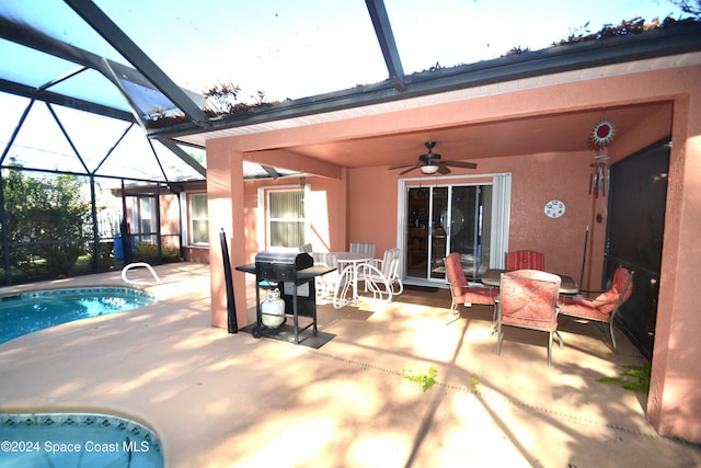 exterior space featuring a lanai, ceiling fan, a patio area, and a grill