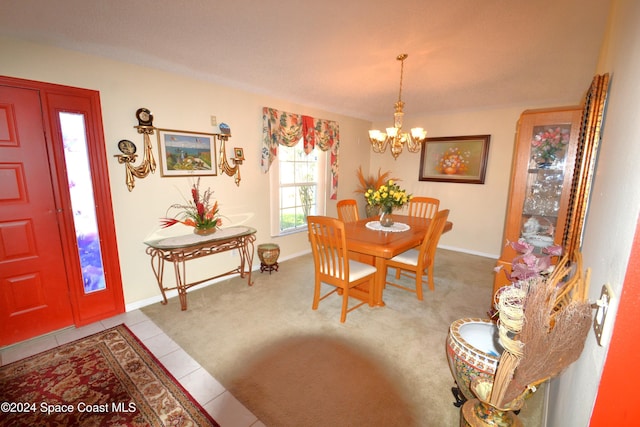 dining room with light carpet and a notable chandelier