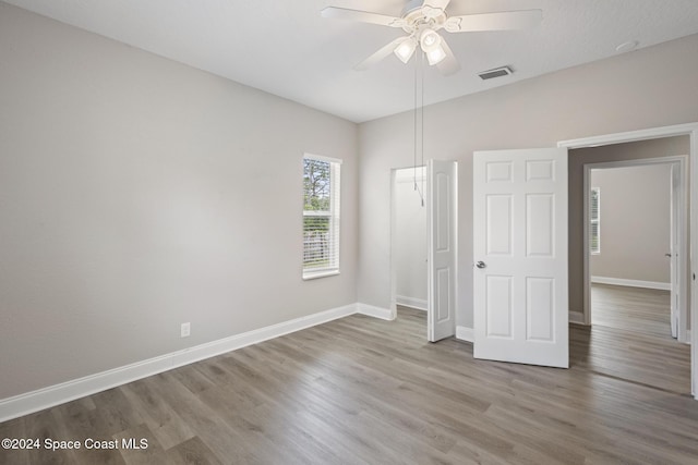 unfurnished bedroom featuring ceiling fan and wood-type flooring