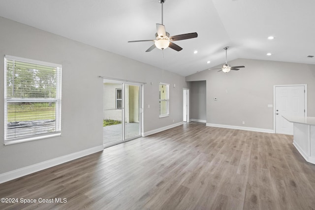 unfurnished living room featuring light hardwood / wood-style floors, vaulted ceiling, and ceiling fan