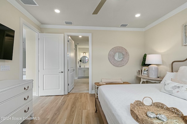 bedroom featuring connected bathroom, light hardwood / wood-style floors, ceiling fan, and ornamental molding