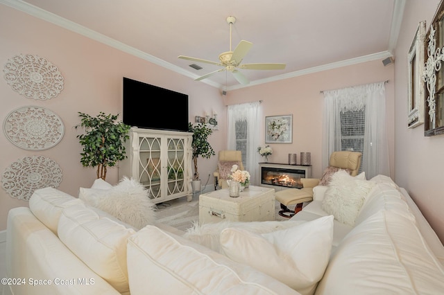 living room with ceiling fan and crown molding