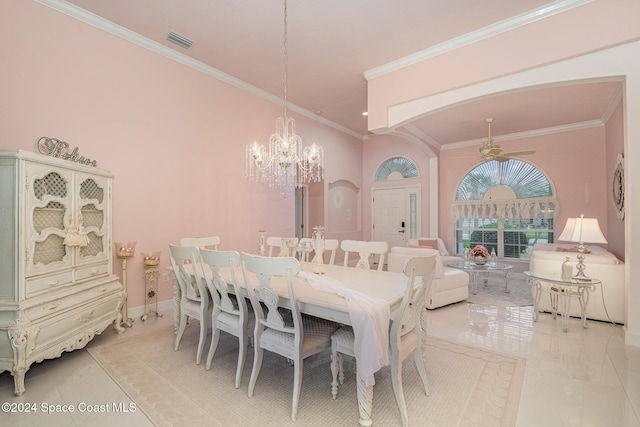 tiled dining room featuring ceiling fan with notable chandelier and ornamental molding