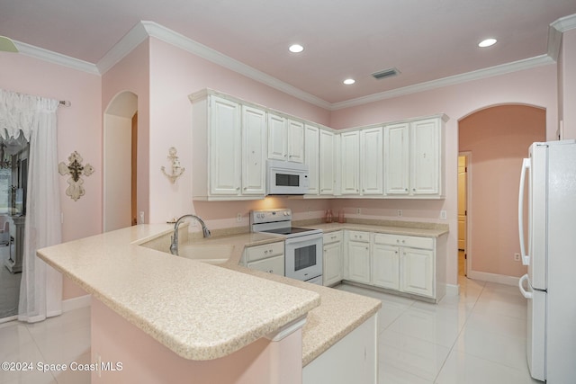 kitchen featuring kitchen peninsula, sink, white appliances, light tile patterned floors, and white cabinets