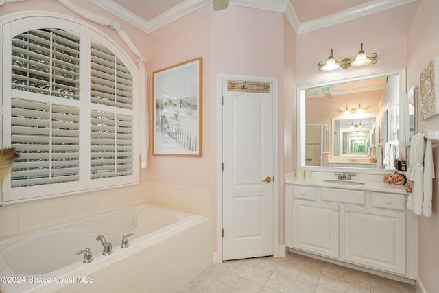 bathroom featuring tiled bath, crown molding, tile patterned floors, and vanity