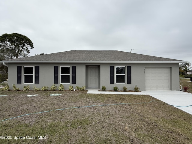 ranch-style home with a garage and a front lawn