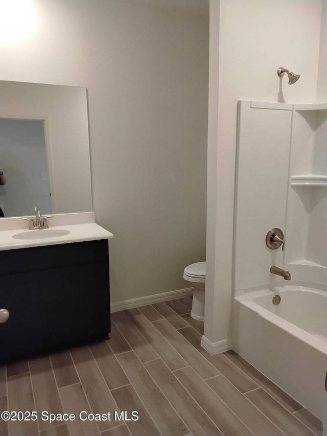 full bathroom with vanity,  shower combination, and toilet