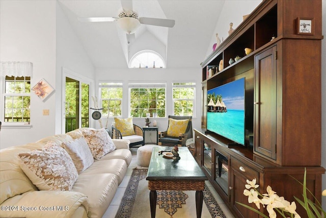living room featuring high vaulted ceiling and ceiling fan
