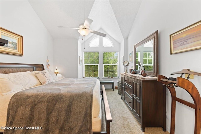 carpeted bedroom featuring vaulted ceiling and ceiling fan