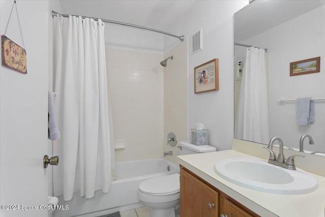 full bathroom featuring tile patterned floors, shower / bath combination with curtain, toilet, and vanity