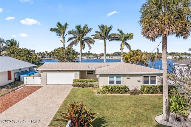 ranch-style home featuring a water view and a front yard