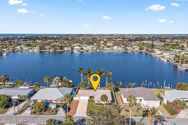 birds eye view of property with a water view