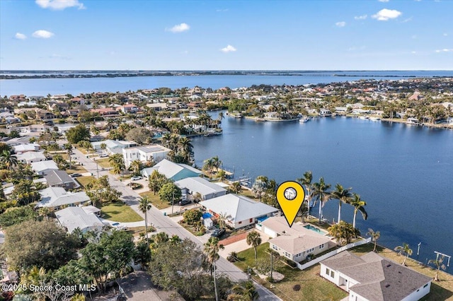 birds eye view of property featuring a water view