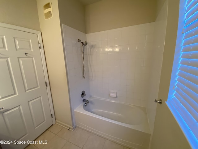 bathroom featuring tile patterned floors and tiled shower / bath combo