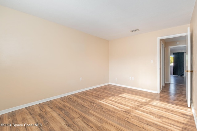 spare room with light hardwood / wood-style floors