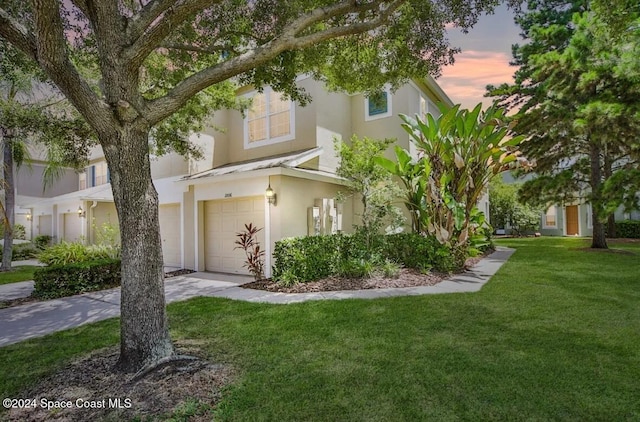 1006 Vista Cay Ct, Brandon, FL 33510 - view of front of house with a lawn and a garage