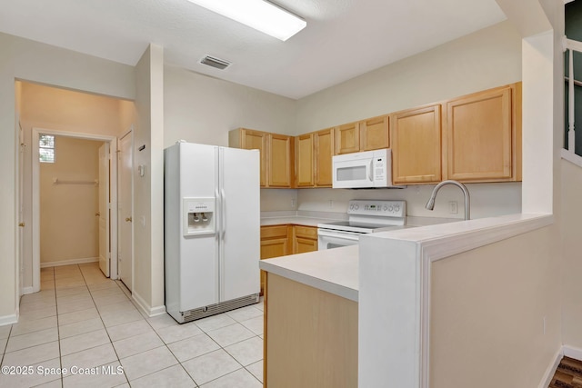 kitchen with white appliances, light brown cabinetry, sink, kitchen peninsula, and light tile patterned floors