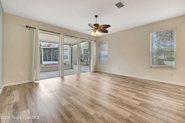 unfurnished room featuring ceiling fan and light wood-type flooring