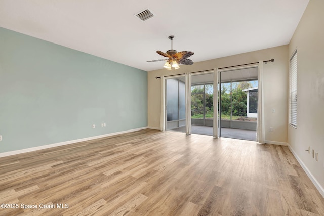 spare room featuring ceiling fan and light wood-type flooring