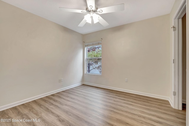 unfurnished room with ceiling fan and light wood-type flooring