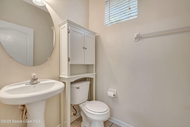 bathroom featuring tile patterned floors and toilet