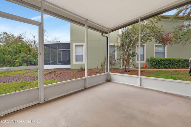 unfurnished sunroom featuring plenty of natural light