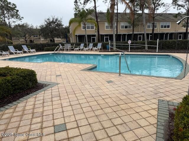 view of pool featuring a patio