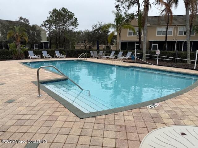 view of swimming pool featuring a patio area