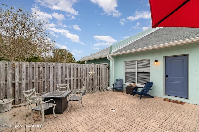 view of patio featuring a fire pit