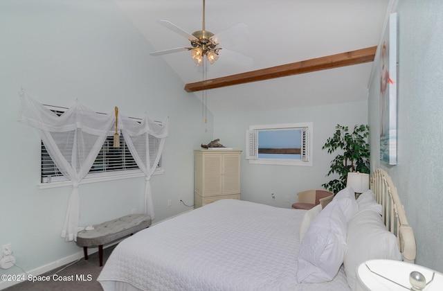 carpeted bedroom with ceiling fan and vaulted ceiling