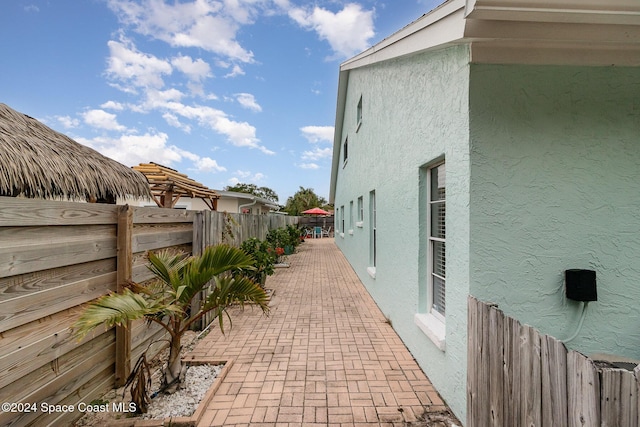 view of side of property featuring a patio area