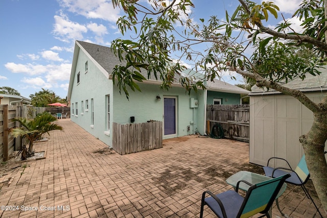 back of property featuring a patio