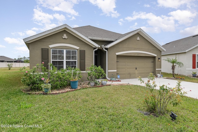 single story home featuring a front yard and a garage