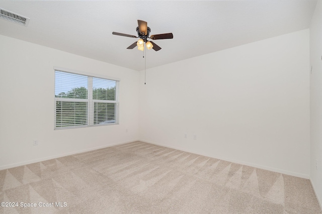 carpeted empty room with ceiling fan