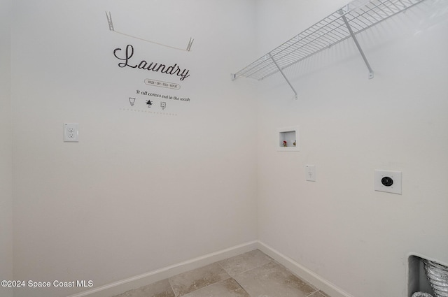 clothes washing area featuring electric dryer hookup and hookup for a washing machine