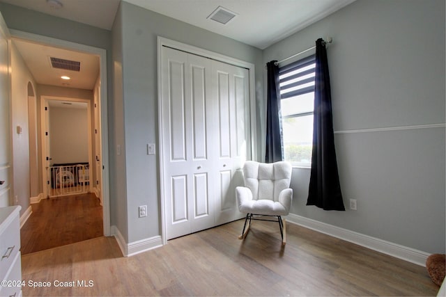 sitting room featuring light hardwood / wood-style floors