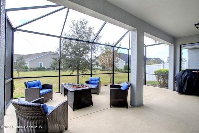 view of patio featuring a grill and an outdoor living space with a fire pit