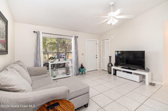 living room with light tile patterned floors, vaulted ceiling, and ceiling fan