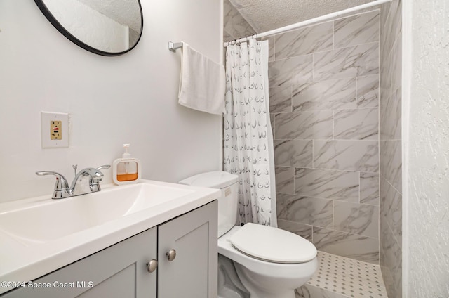 bathroom featuring toilet, vanity, a textured ceiling, and a shower with shower curtain