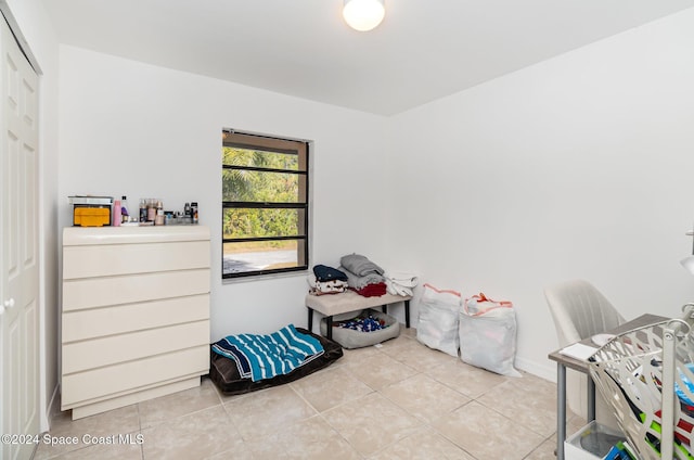 miscellaneous room with light tile patterned floors