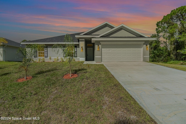 ranch-style home with stucco siding, an attached garage, concrete driveway, and a front lawn