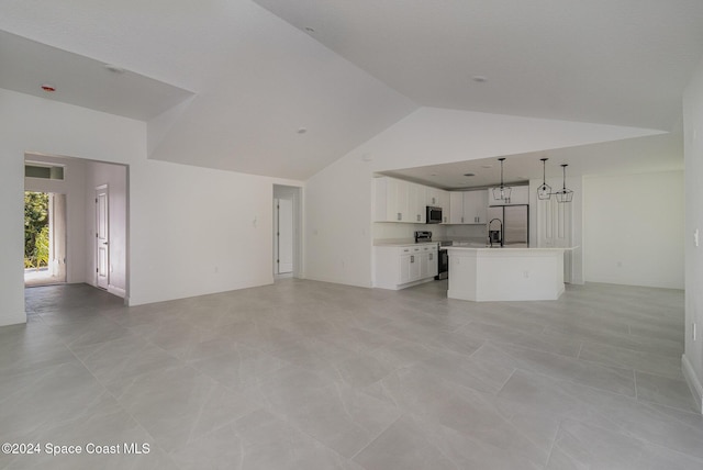 unfurnished living room featuring visible vents and high vaulted ceiling