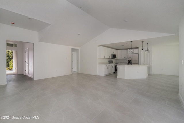 963 Sareta St SE, Palm Bay, FL 32909 - unfurnished living room with high vaulted ceiling